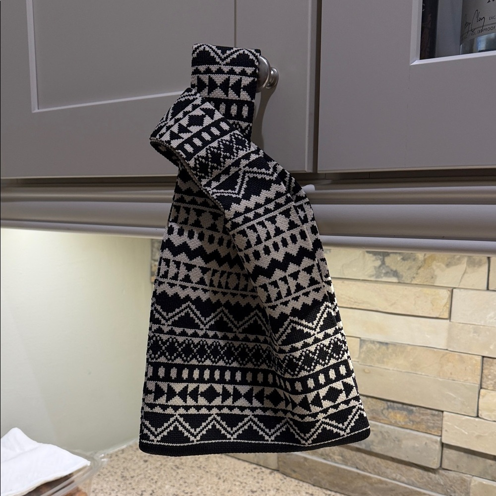 Artsy knit patterned black and cream handbag.